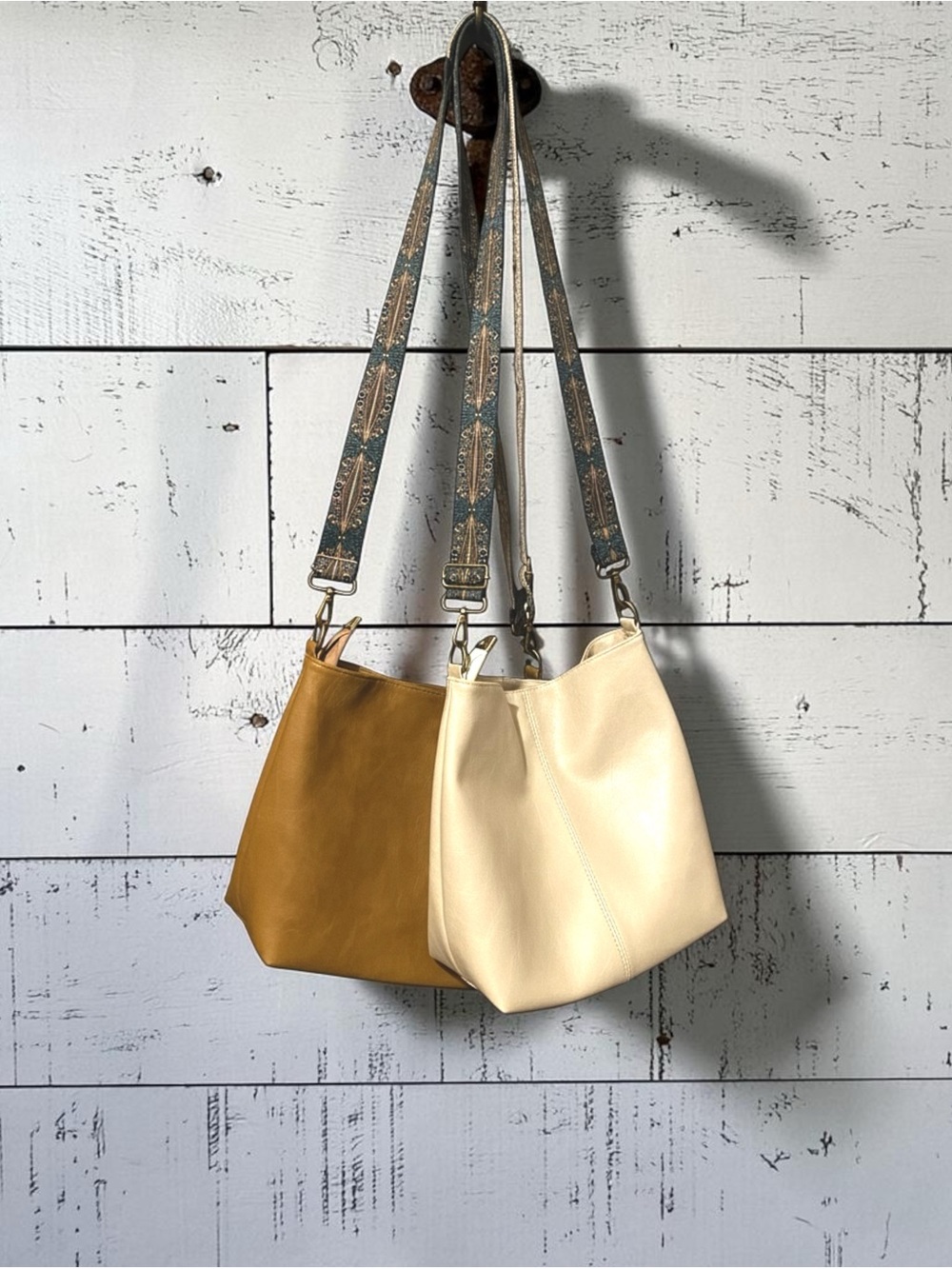 2 Lightweight Bucket Bags- Cream & Caramel Tan. Comes W/ 1 Free Extra Strap!